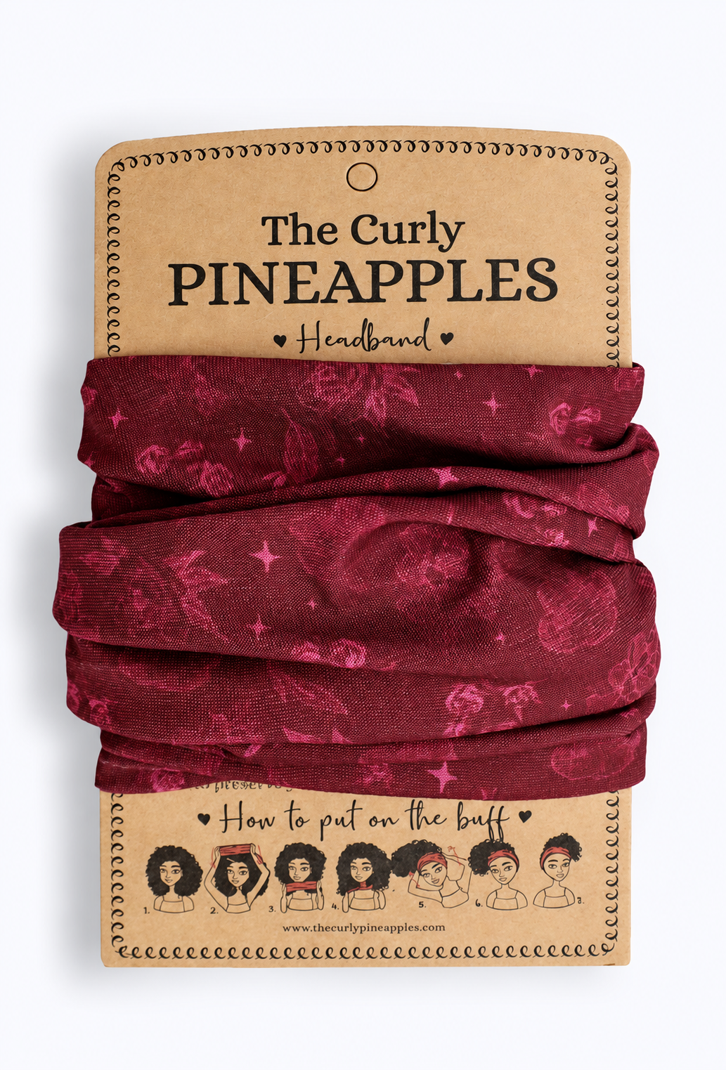 The Curly Pineapples Crimson Floral Headband on branded cardboard packaging against a light background.